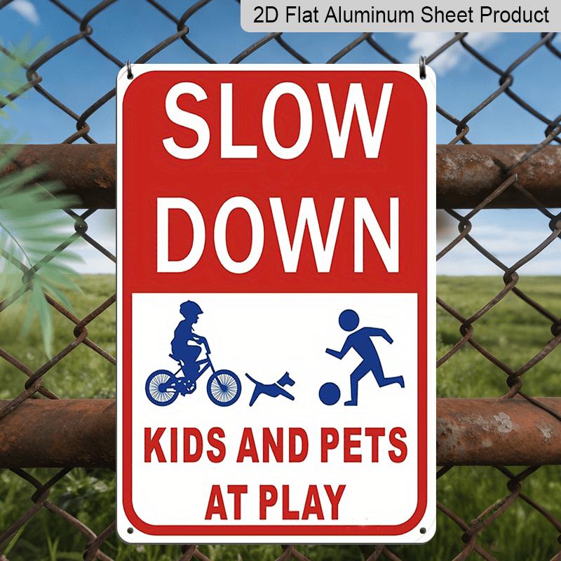 2D Flat Slow Down At Play Metal Sign - Durable Metal Safety Signage, 12*8 Inches, Easy To Install, Red and White with Blue Graphics, Perfect for