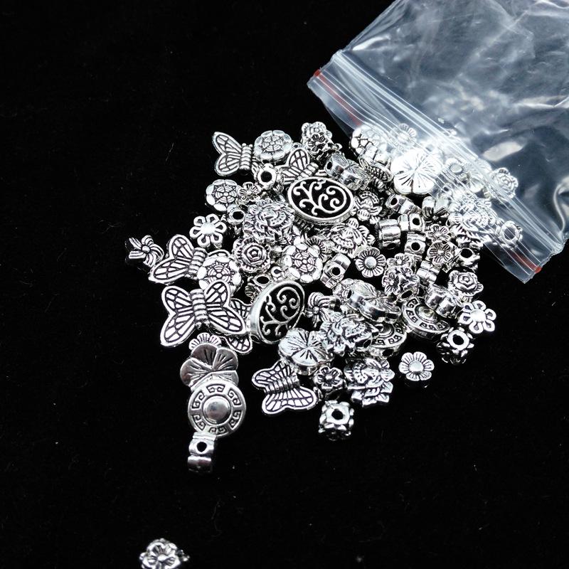 Tibetanisches Silber Schmuck-Set: 50g Gemischte Anhänger, Vintage Armband, Blumenbecher-Abstandshalterperlen für DIY Handgemachte Kreationen