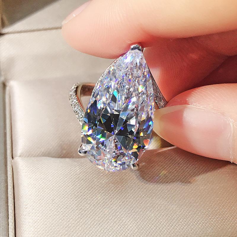 

Благородное женское кольцо с бриллиантом S925 Серебряное кольцо с высоким содержанием углерода с бриллиантом Капля воды 12 * 22 Предложение Обручальное кольцо