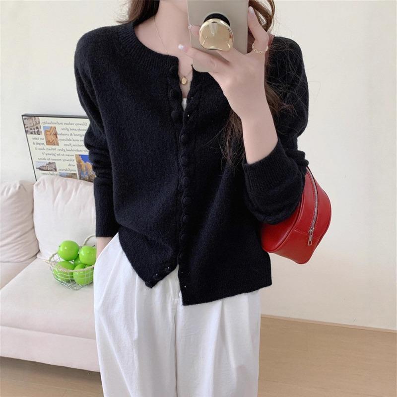 Autumn new solid color round neck single-breasted splicing long-sleeved knitted sweater women's fashion age-reducing top