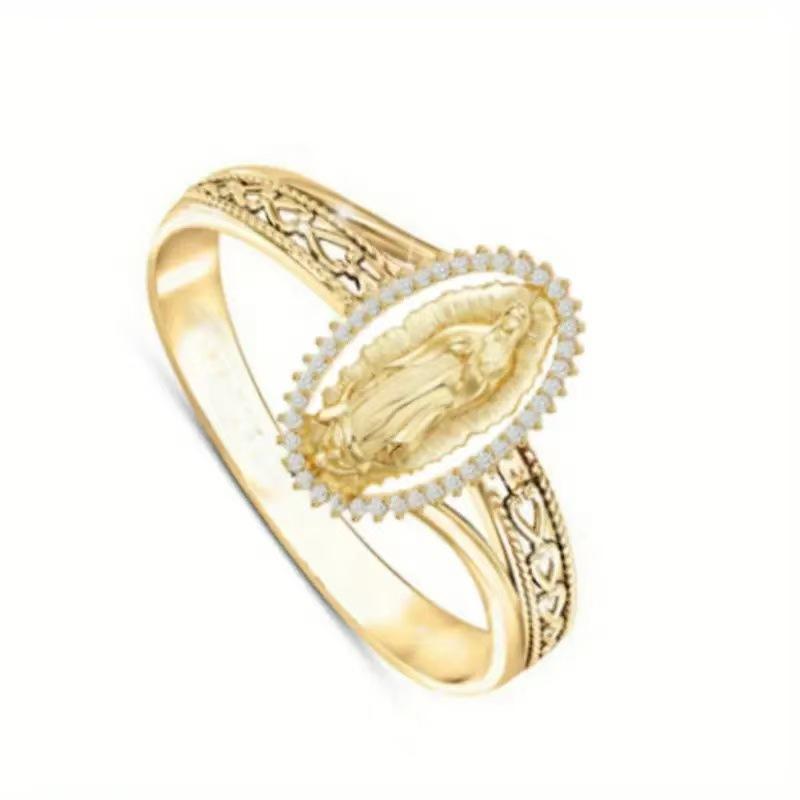 Elegant oval-shaped gold ring with diamonds surrounding the image of the Virgin Mary, versatile and elegant
