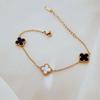 Women's Gold-Plated Titanium Steel Four-Leaf Clover Bracelet - Black & White, Double-Sided, Simple Luxury Design