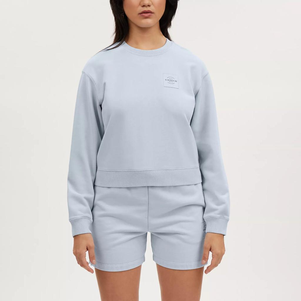 Coach Rõivavärvusega kreemjas ümar kaelusega pusa