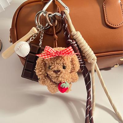 Muñeca de perro con lazo de felpa, bolsa de cuerda tejida, colgante, accesorio para cordón de teléfono móvil
