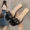 2025 new summer fairy wind flower one-word slippers female summer wear fashionable versatile niche thick heel cool slippers