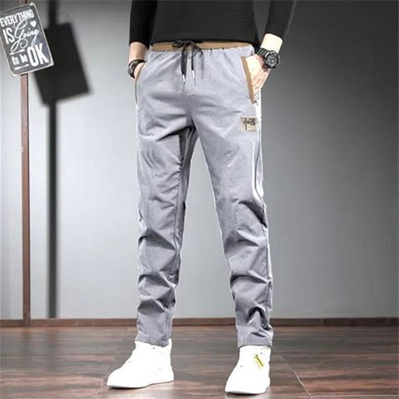 Autumn and winter men s pants fashion casual pants loose and versatile mid-waist slim-fitting elastic straight sports men s trousers 5XL