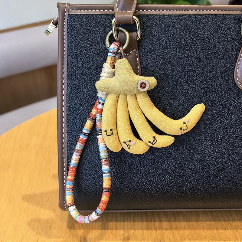 Handmade Fabric Banana Keyring, Whimsical Banana Pendant with Multicolor Braided Cord,Smiley Face Banana Bunch Bag Charm with Colorful Braided Strap