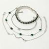 European & American Fashion Green Snake Diamond Bangle Set: Women's 4-Piece High-End Metal Jewelry with Elastic Design.