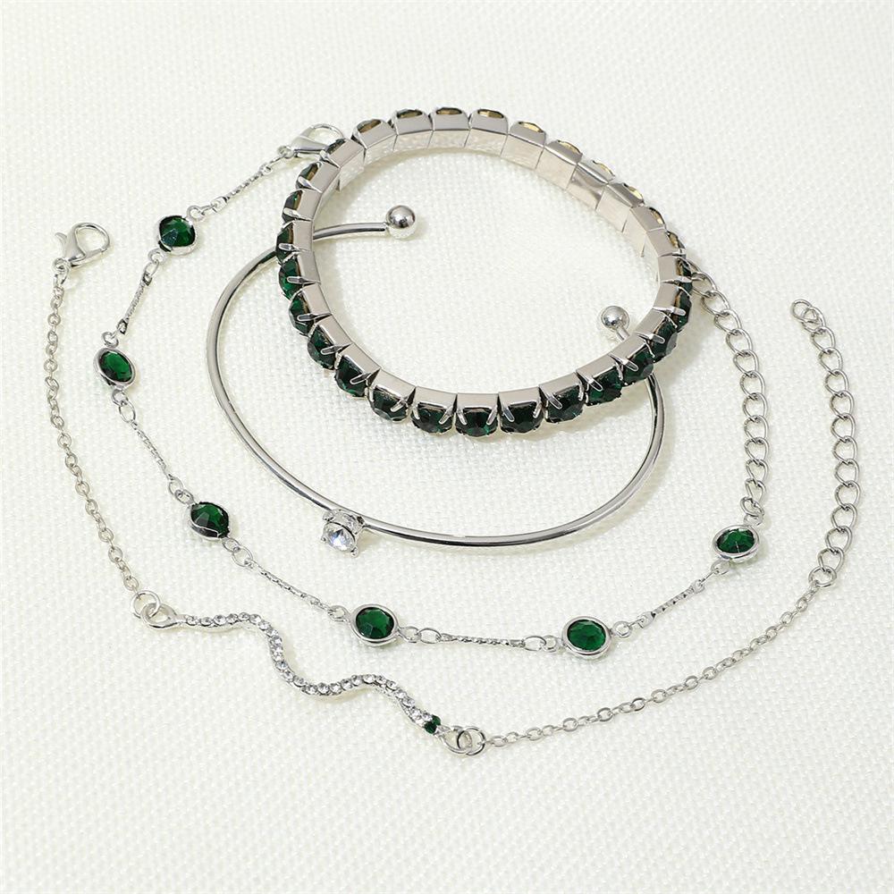 European & American Fashion Green Snake Diamond Bangle Set: Women's 4-Piece High-End Metal Jewelry with Elastic Design.