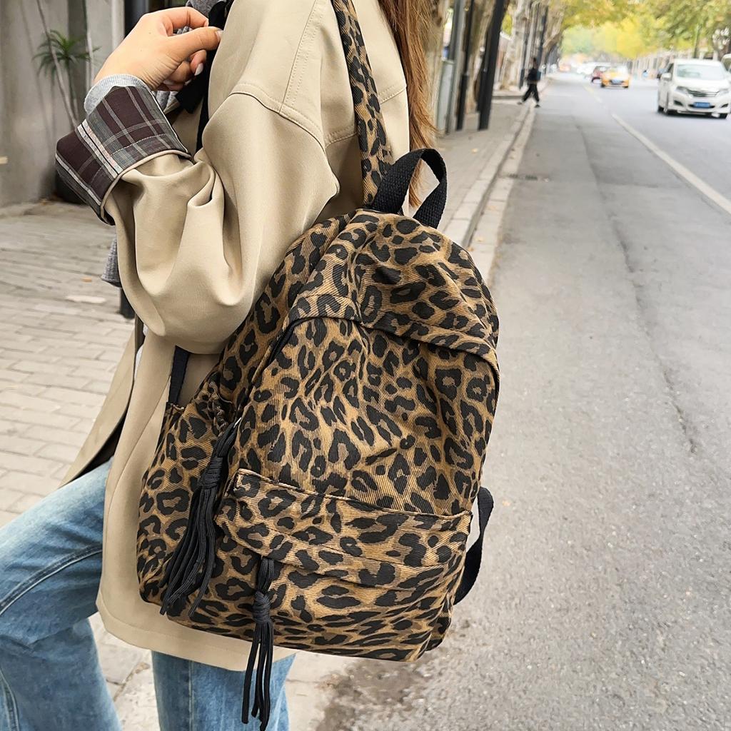 Leopard Print Backpack Casual Daily Use Trendy Street Style Lightweight Backpack for Women with Tassel Detail for School Travel and Everyday Outings