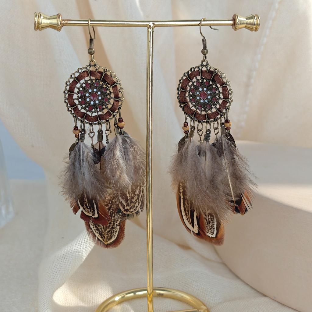Retro ethnic style woven feathers long fringed earrings, bohemian high-end hollow rice bead earrings