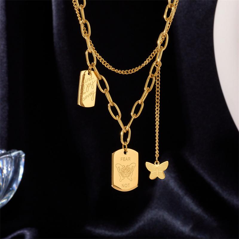 

Layered Gold Chain Necklace with Inspirational Dog Tags and Butterfly Charm one size