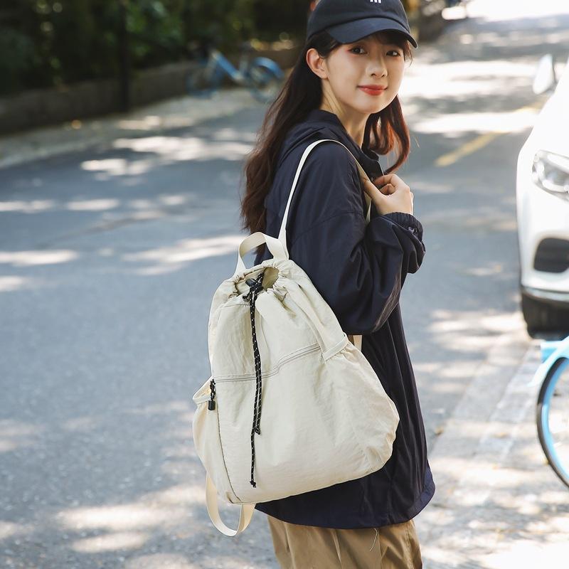 Schoolbag Korean version of nylon cloth niche design schoolbag women's casual lightweight drawstring backpack large capacity versatile simple backpack
