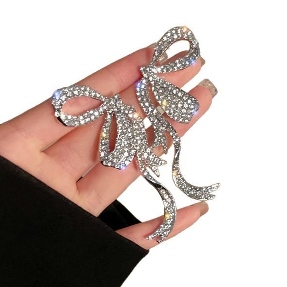Exquisite Rhinestone Bow Tassel Earrings: Silver Needle French Court Style Luxury Ear Studs for Women.