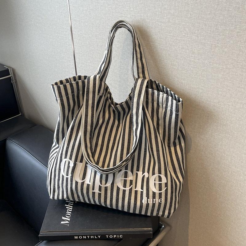 

Large capacity striped tote bag women s 2024 new trendy fashion literary shoulder canvas bag portable environmentally friendly cloth bag синій