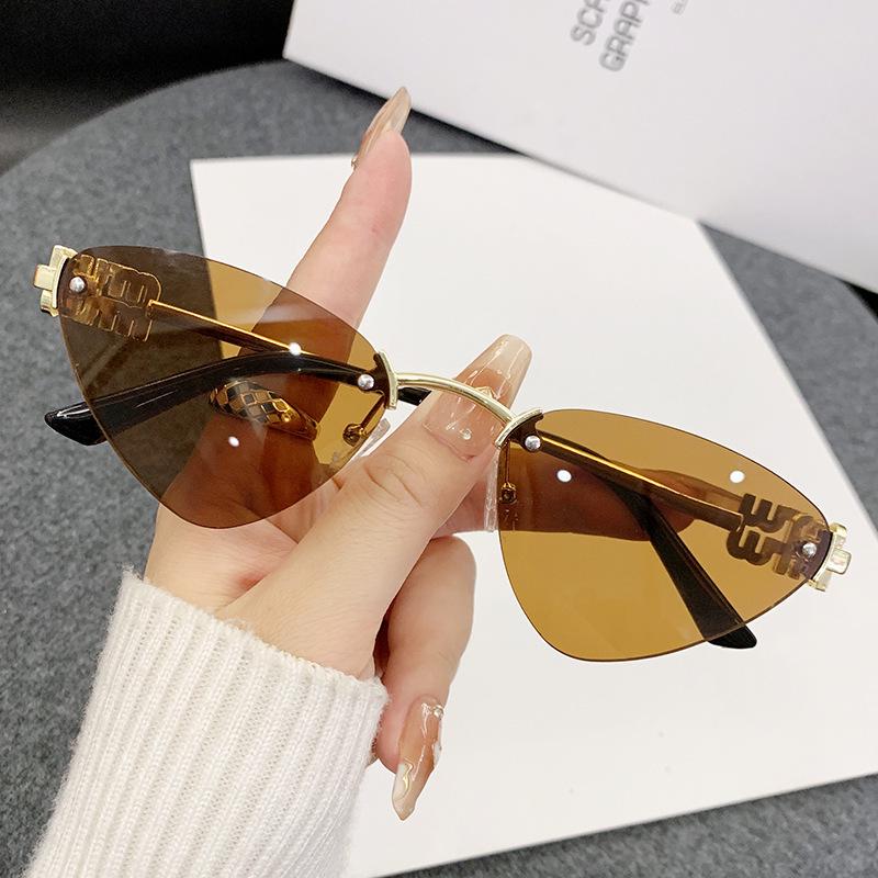 Miao's Frameless Cat-Eye Sunglasses: Women's High-End European & American Style with Hollow Letter Design.