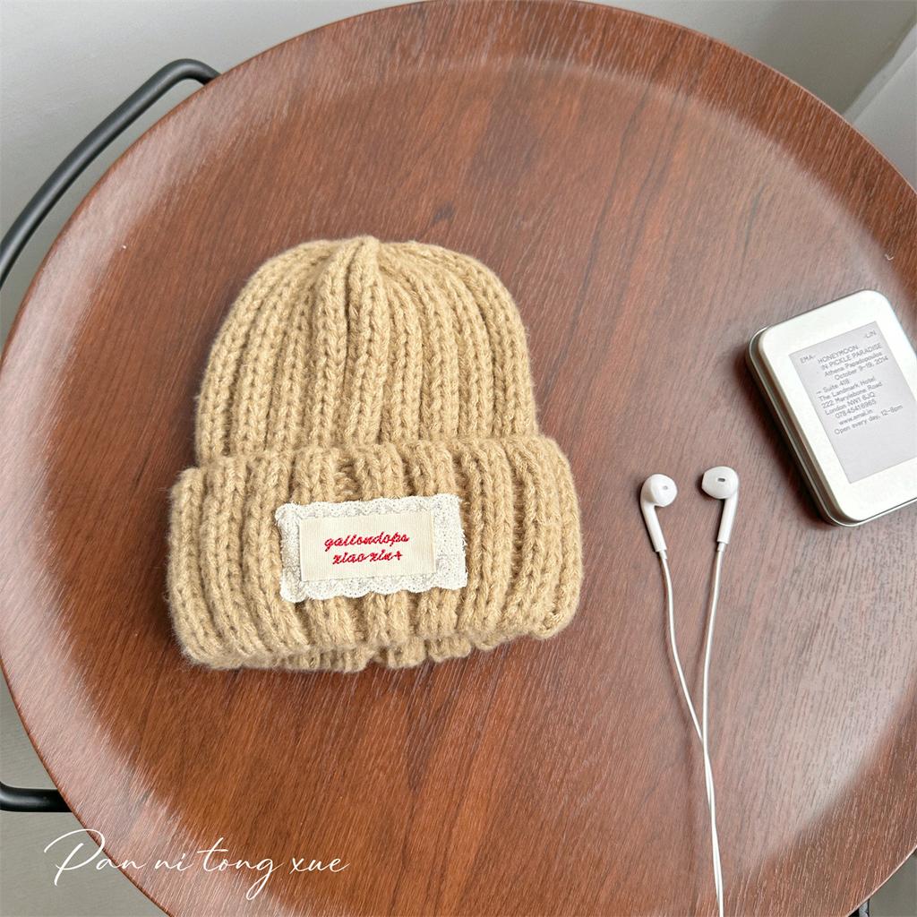 Neue Spitze Etikett Kinder Wollmütze Nuojiji Student Herbst und Winter Neu Warm und Vielseitig Ohrenschutz Strickmütze