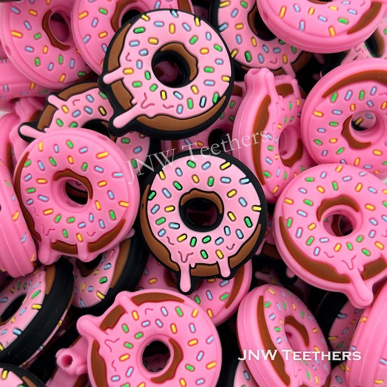 

Силиконовые пончики с фокусными бусами.