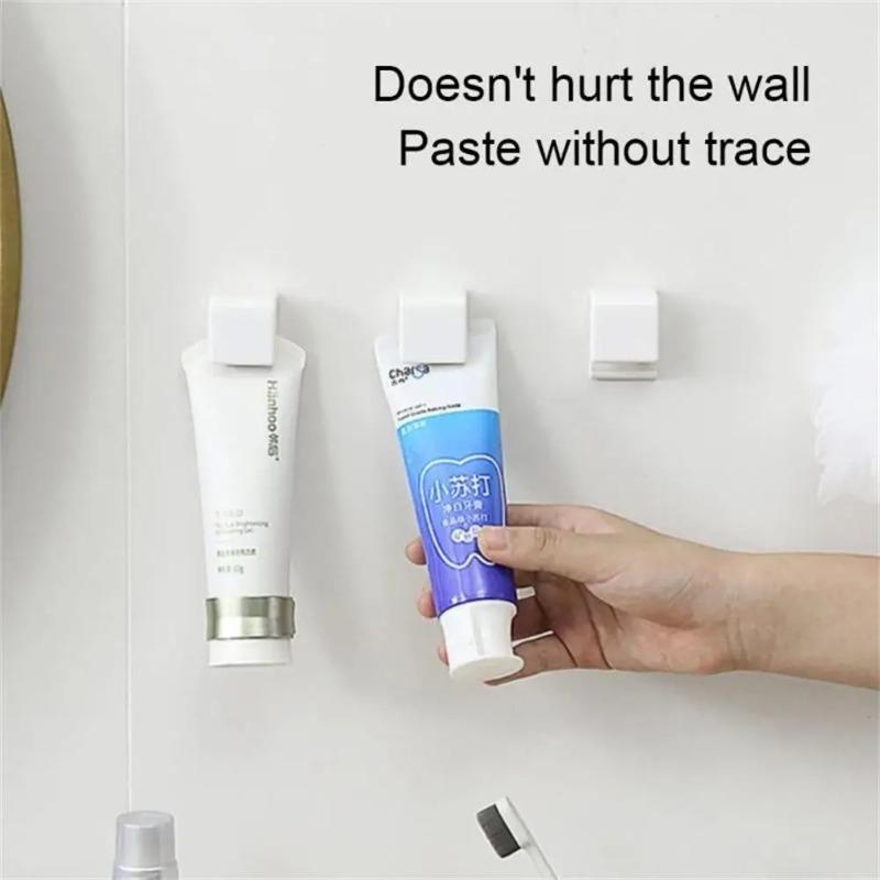 1pcs Toothpaste Storage Clip Non-marking Toothpaste Cleanser Rack Bathroom Hanging Clip Cleanser Clip Bathroom Accessories Hanger