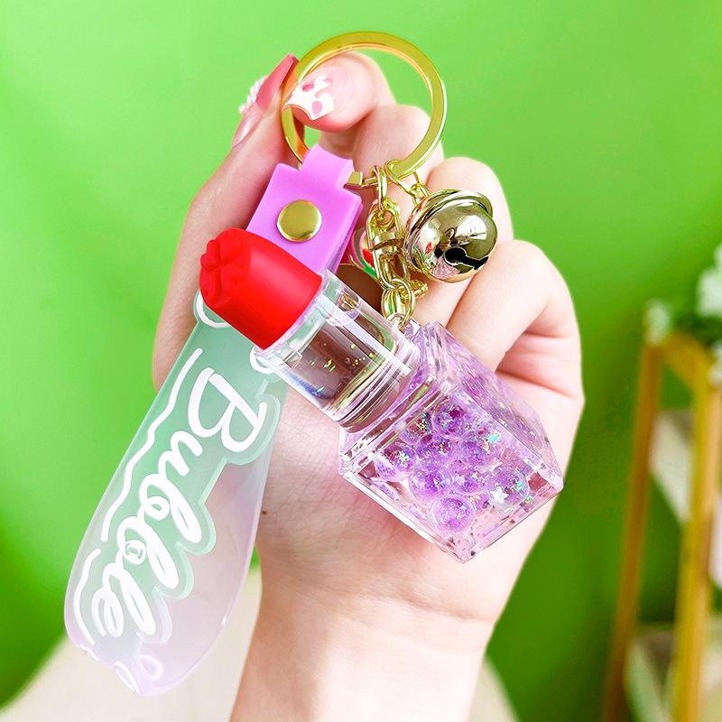 

Luminous Bubble Bead Lipstick Keychain: Cute Liquid Quicksand Fashion Pendant. фиолетовый