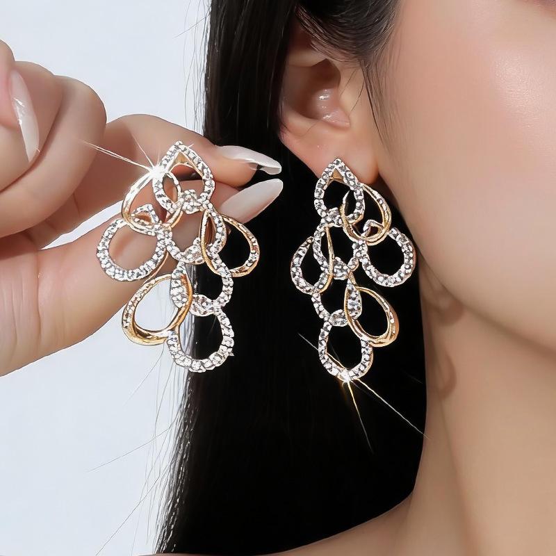 Elegant Water Drop Diamond Hollow Earrings - Silver Needle, European & American Style, Exaggerated Fashion, Luxurious High-End Design.