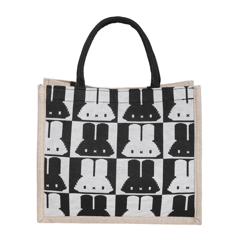 Handtaschen mit großem Fassungsvermögen sind dieses Jahr beliebt, und Damen 2025 neue trendige Mode und niedliche Schultertaschen mit Kaninchenaufdruck.