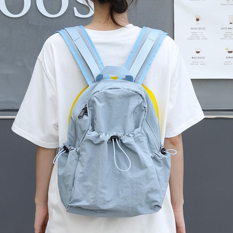 IELGY Korean version of casual literary canvas schoolbag, pleated nylon drawstring backpack, fashionable Oxford cloth backpack.