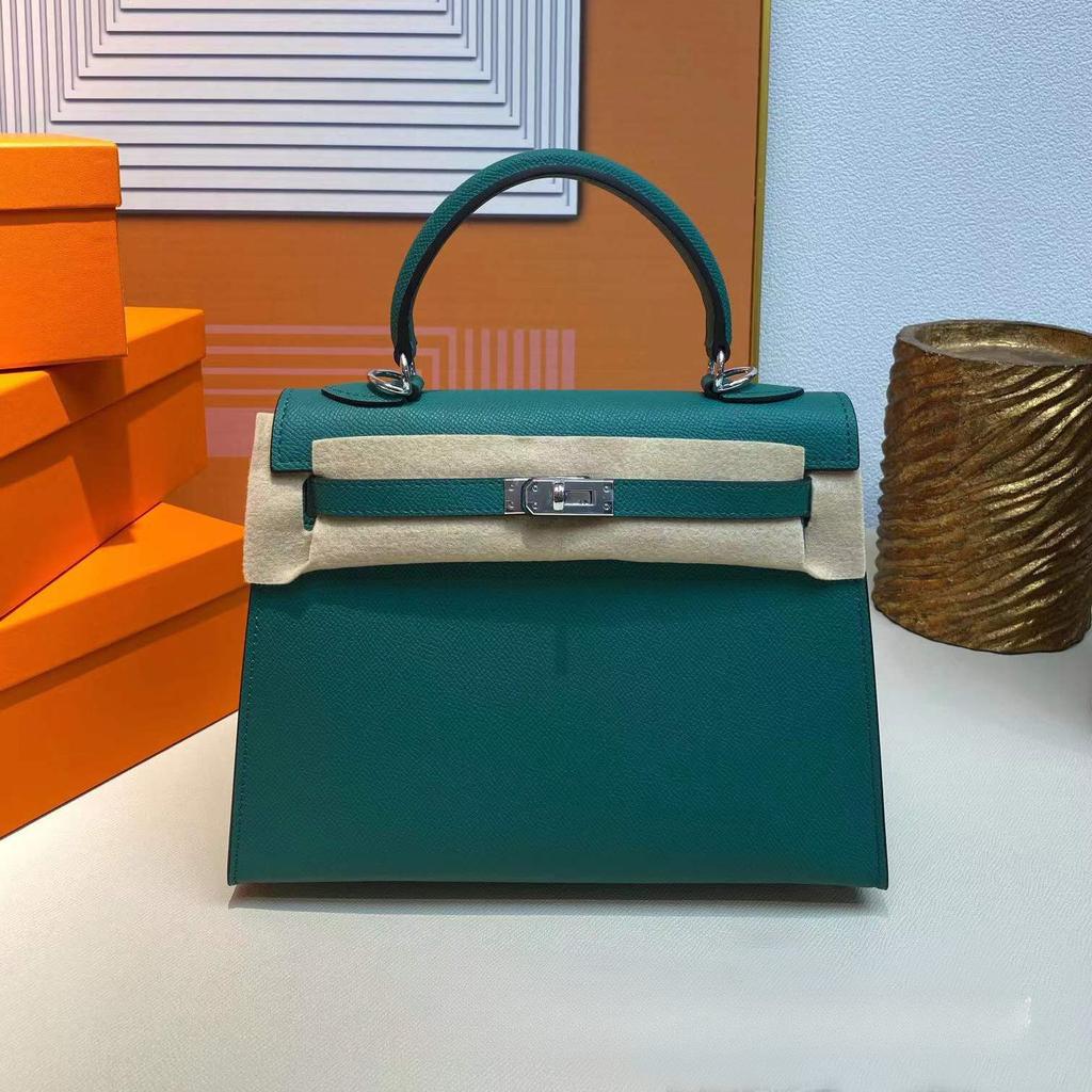 Grenzüberschreitende Hersteller Großhandel Damenhandtaschen 2023 neue Handtaschen aus Leder mit Palmenmuster tragbare Schulter-Umhängetaschen Damenhandtaschen große Kapazität