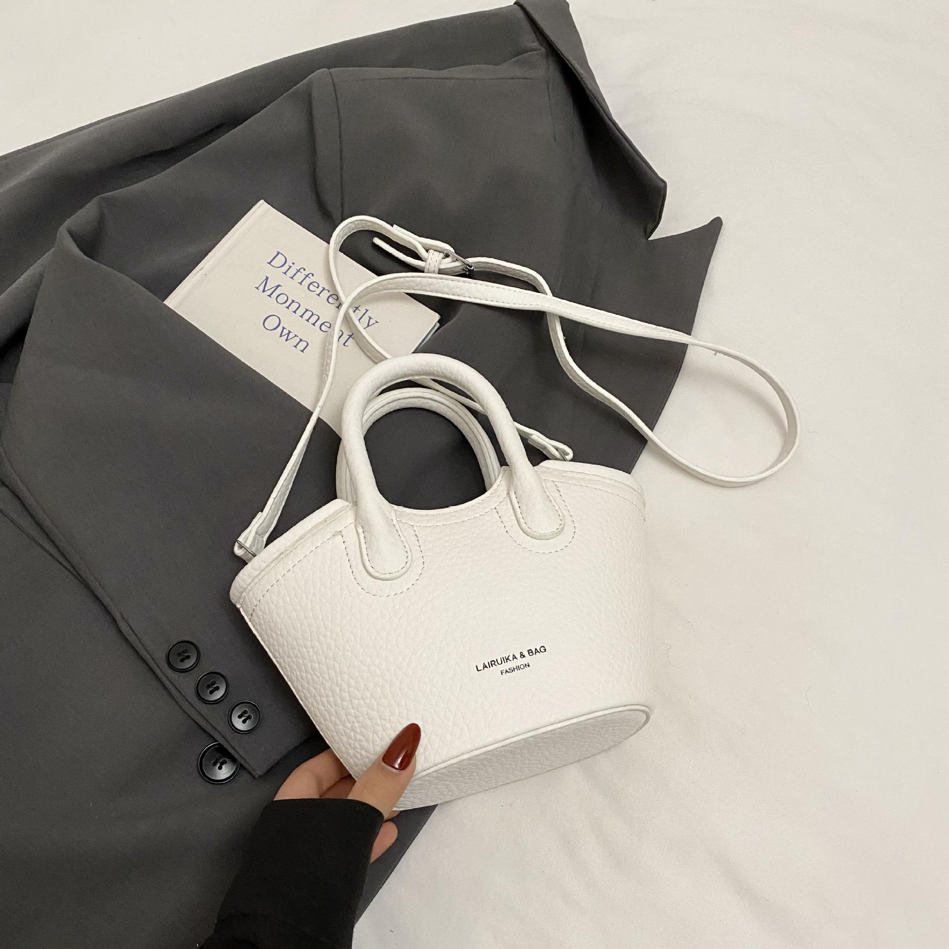 

Премиальная текстура портативная маленькая сумка-ведро женская 2025 новая простая сумка иностранный стиль мини сумка через плечо