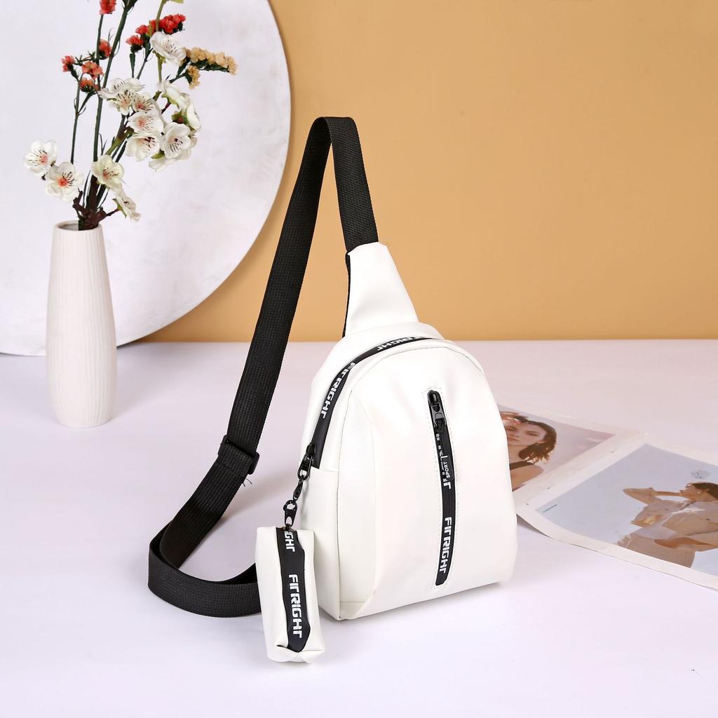 New fashion breast bag, shoulder messenger bag, sports bag with pendant, change bag, letter bag, one piece.