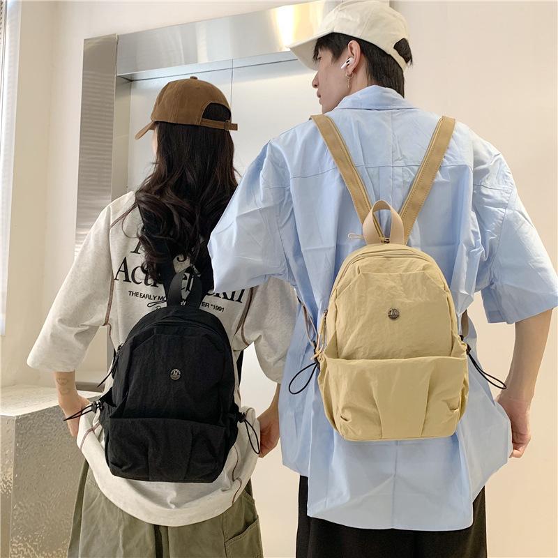 Schoolbag new solid color lightweight small backpack women's simple large capacity breast bag leisure travel commuting versatile portable small 