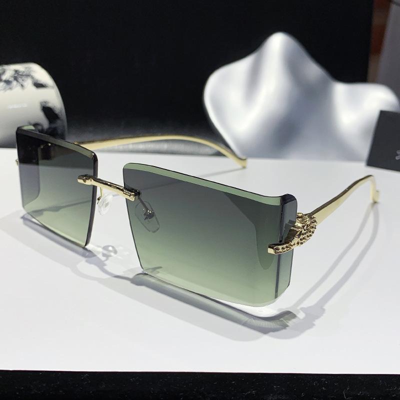 New European and American curved lenses leopard head metal frameless trimmed high-end sunglasses European and American sunscreen glasses