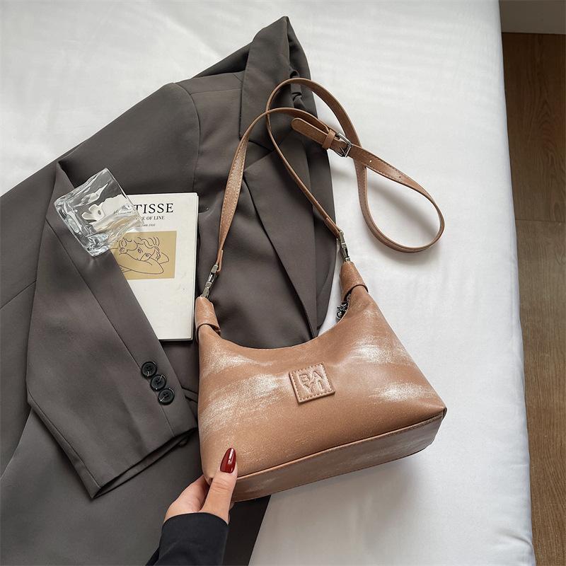 

Модная повседневная сумка-пельмень 2025 новая модная линия портативная на плечо с высоким чувством мессенджер женская сумка