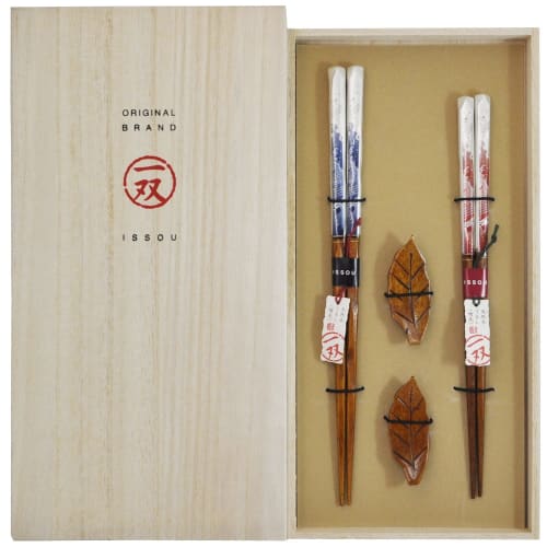 

A pair of lacquered chopsticks for couples, set in a paulownia wood box, with a holly wood chopstick rest, made in Japan.