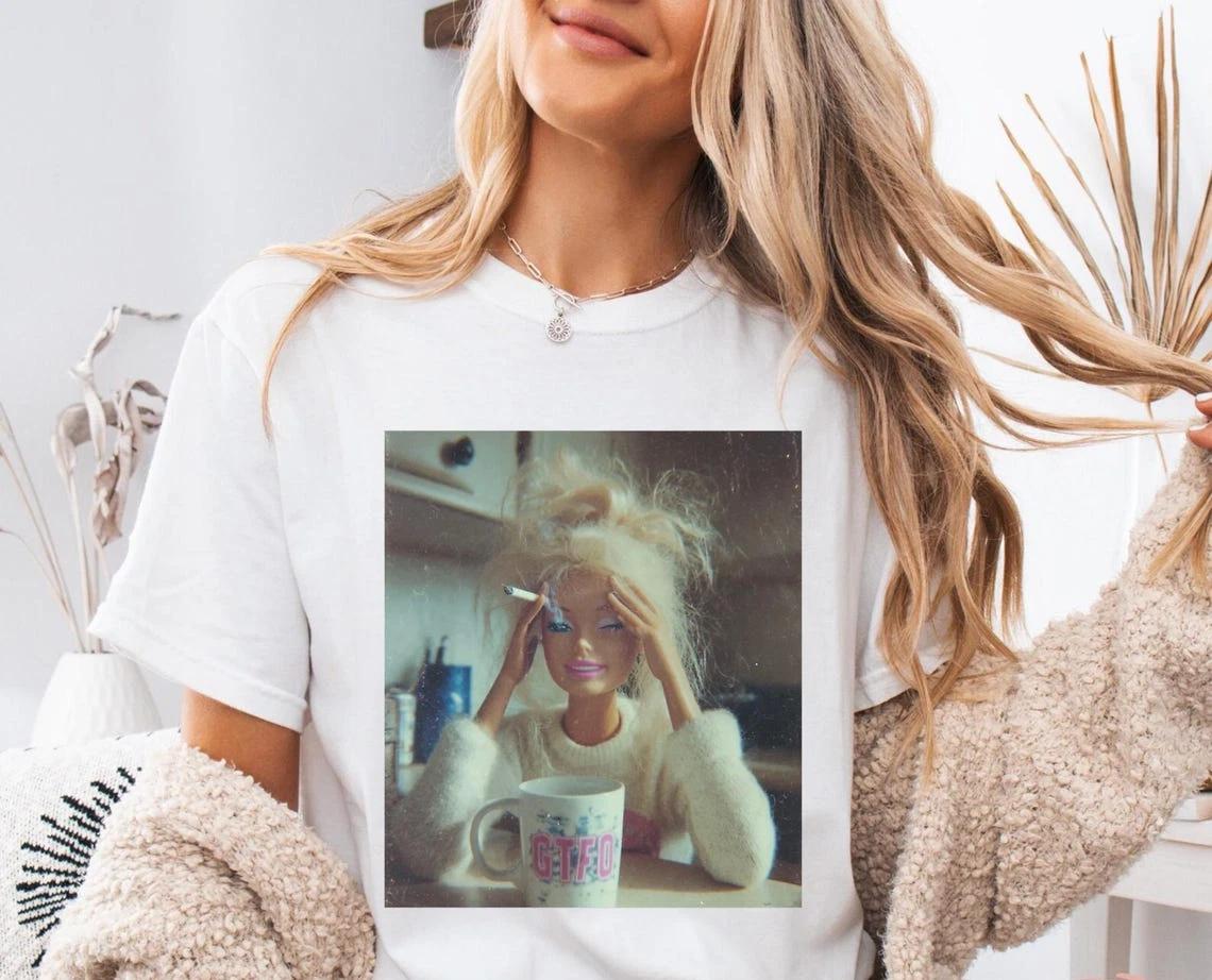 

Distressed Doll Face Meme Shirt – Vintage Viral Humor Graphic Tee S