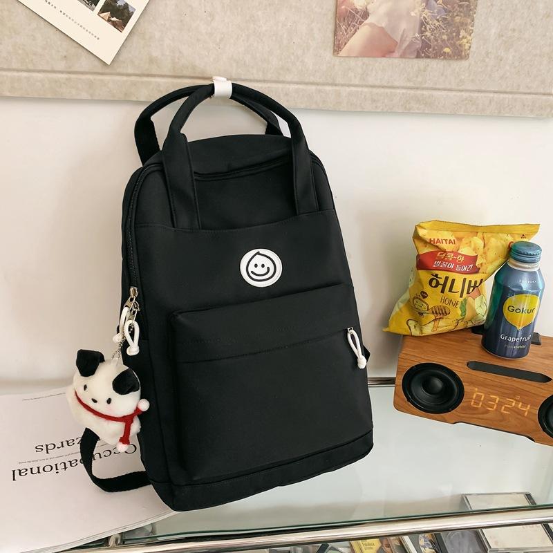 

Girls backpack junior high school student schoolbag women s large capacity solid color nylon handbag чорний