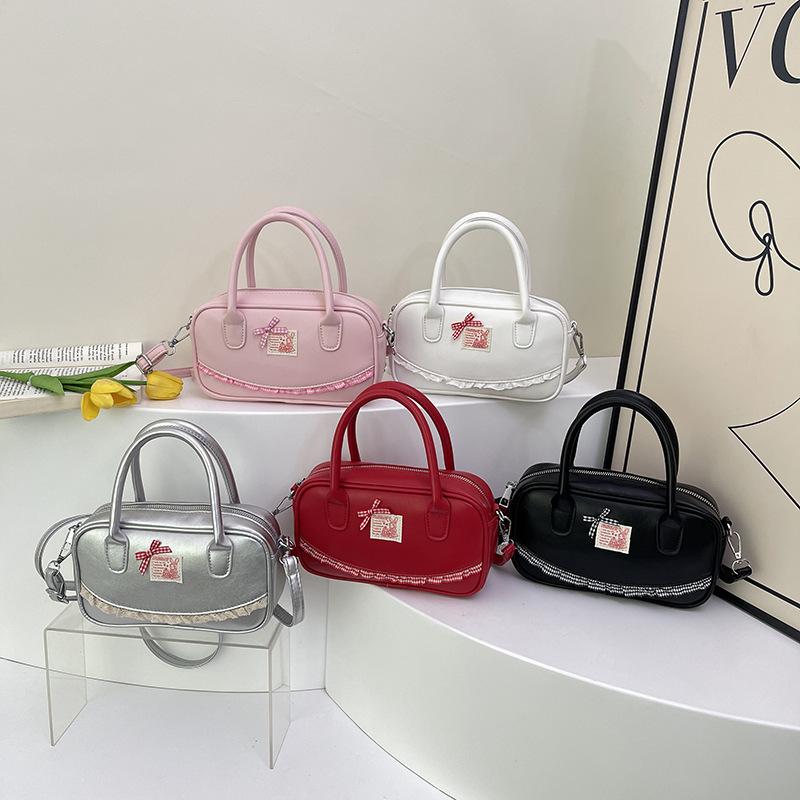 Korean ins hand-held bowling bag women's 2025 spring new fashion shoulder oblique span bag high-end small square bag