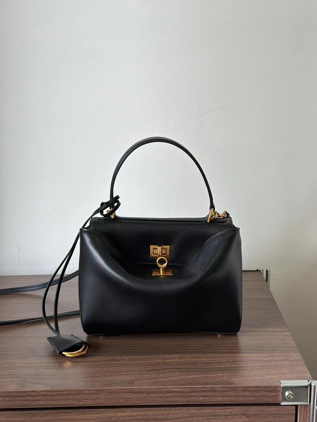 

2025 Нова сумка-тоут Шкіряна жіноча сумка Ледачий стиль Сумка під пахву Велика місткість Кросбоді Сумка через плече 22.8x8.3x9.9cm золотий/чорний