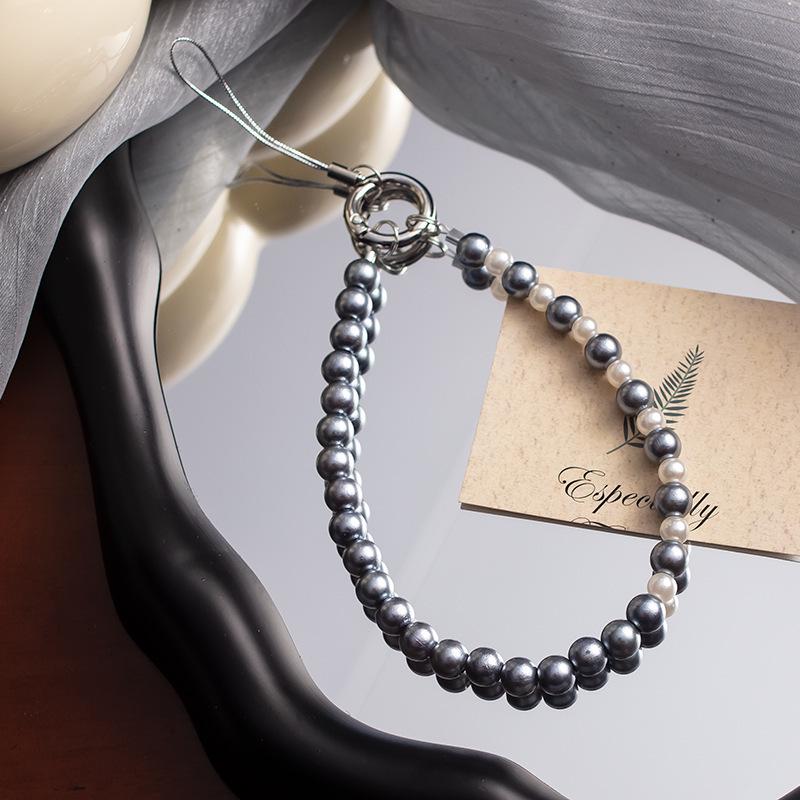 

Жемчужный бант на запястье: Стиль Douyin, Защита от потери, Универсальная высококлассная цепочка из бусин для мобильных телефонов Phone Strap with Bow