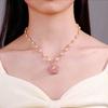 New Rotating Pearl Necklace Women's Niche High-end Design Lucky Flower Pendant Collarbone Chain Sweater Chain Clothing Hanging