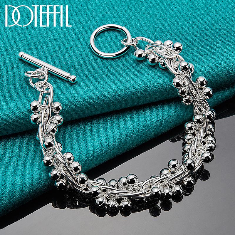 Bracelet de perles de raisin en argent avec breloques