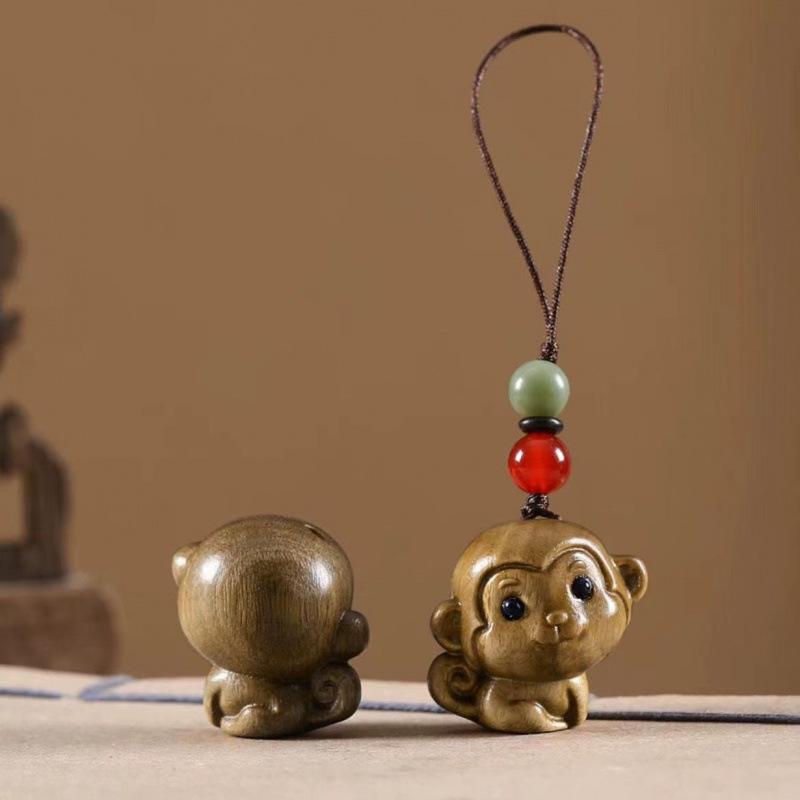 Twelve Zodiac Animal Charms Green Sandalwood Set: Rat, Ox, Tiger, Rabbit, Dragon, Snake, Horse, Sheep, Monkey, Rooster, Dog, Pig.