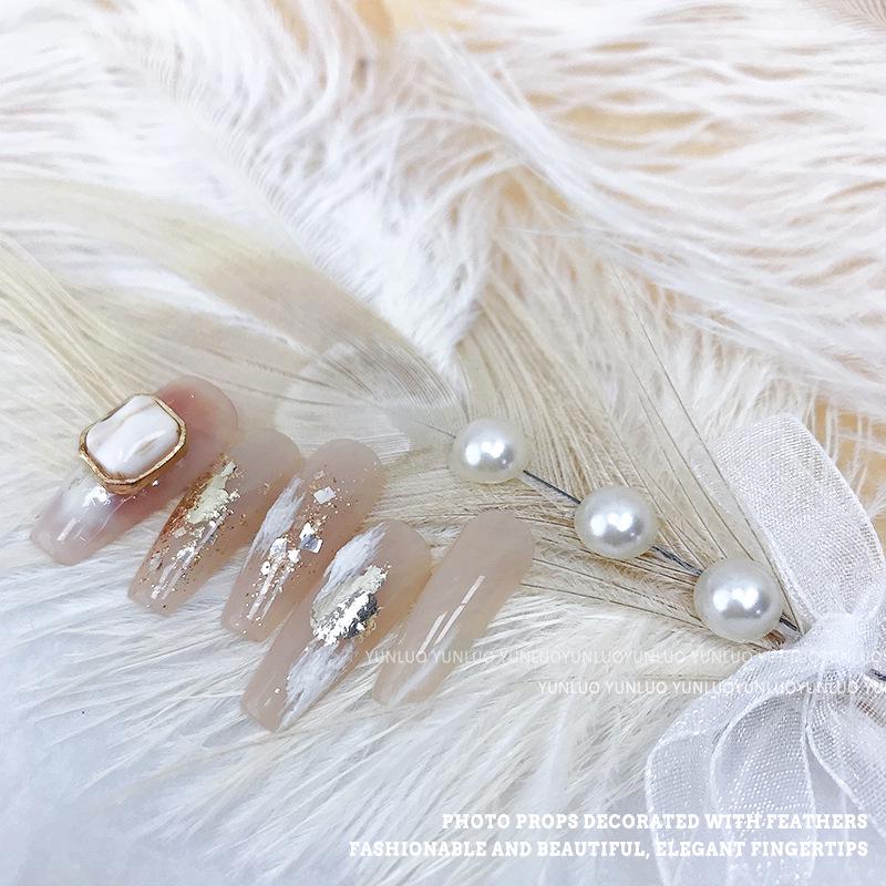 Pearl-Adorned White Feather Nail Art Props for Photo Shoots
