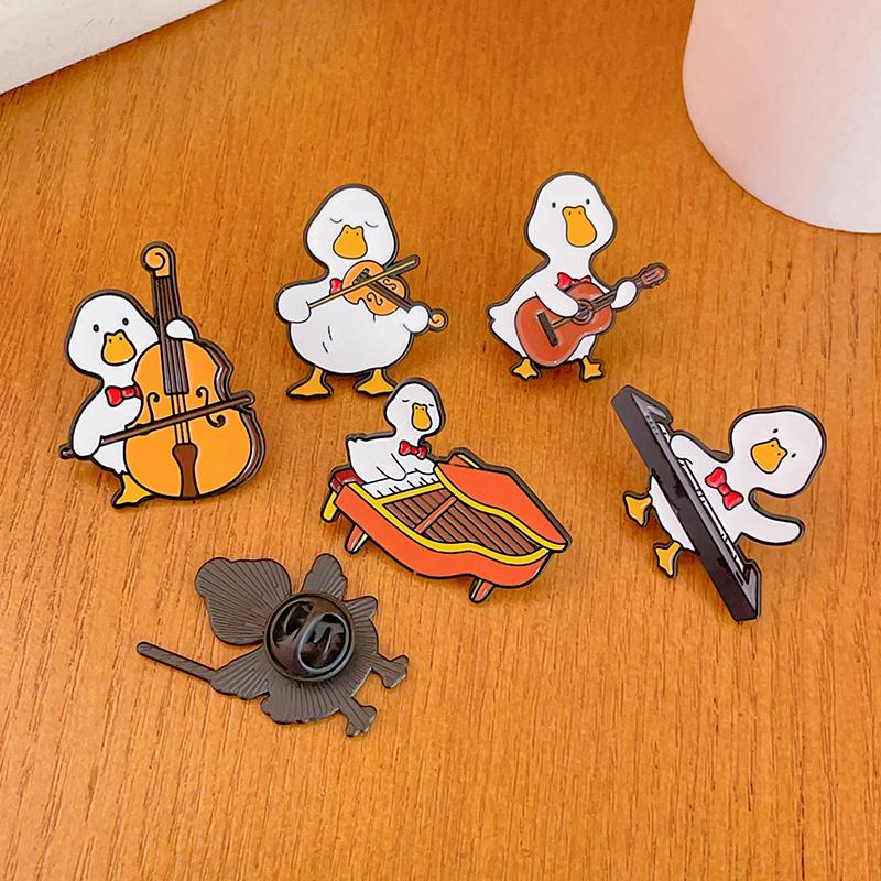 Cute Musician Duck Enamel Brooch Creative Cartoon Violin Piano Baton Guitar Animals Lapel Pins Backpack Jewelry Gifts For Kids
