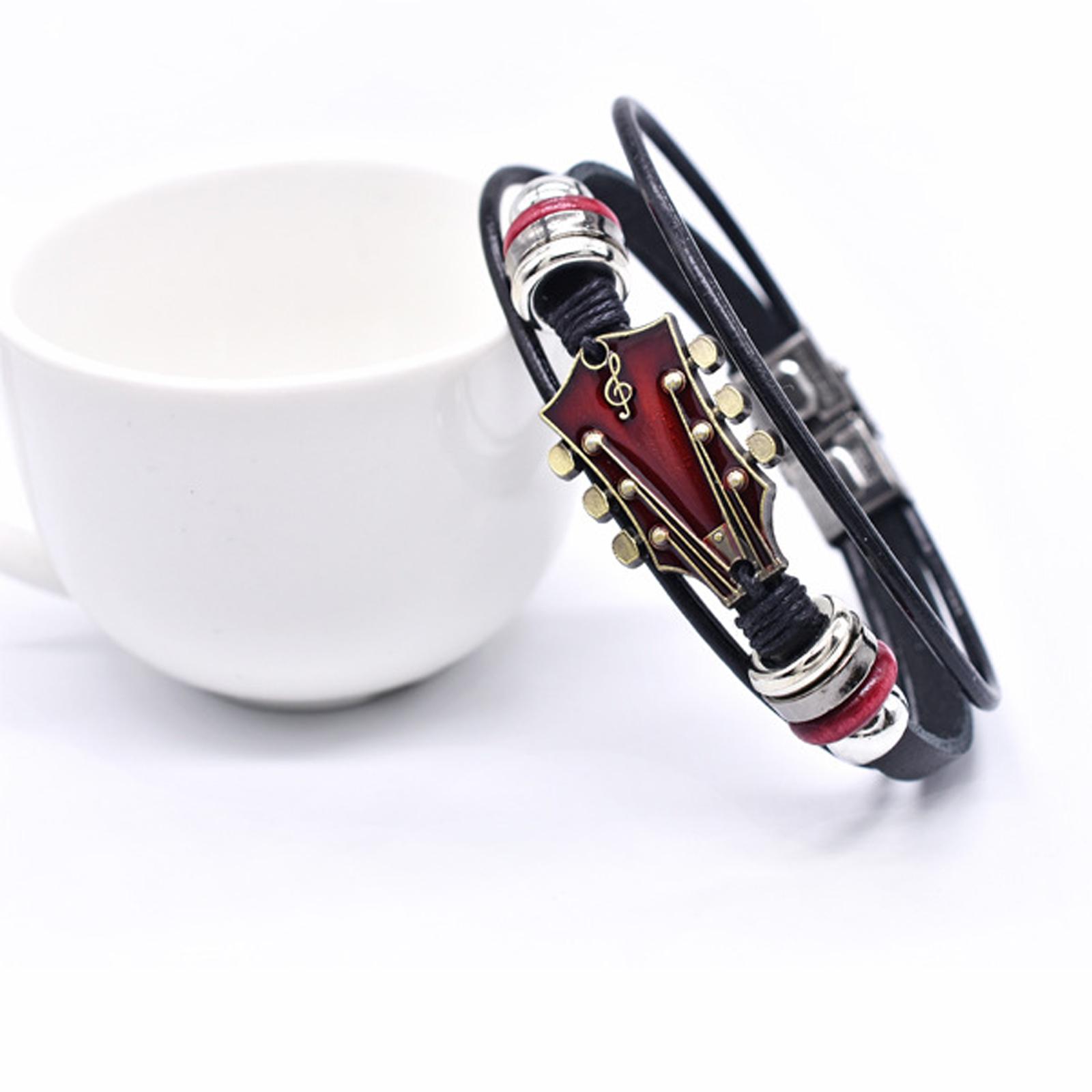 

Alloy Music Guitar Leather Bracelet With Flag Colored Enamel Stainless Steel Buckle And Woven Leather Strap. One Size