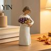 Minimalist Desk Ornament Girl Holding Bouquet Resin Figurine, Faceless Lady Statue, Romantic Desktop for Flower Statue Living Room Bedroom Home Decor,
