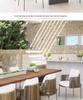 Outdoor Rattan Dining Set: Long Table with Casual Woven Chairs for Garden, Terrace, or Courtyard.
