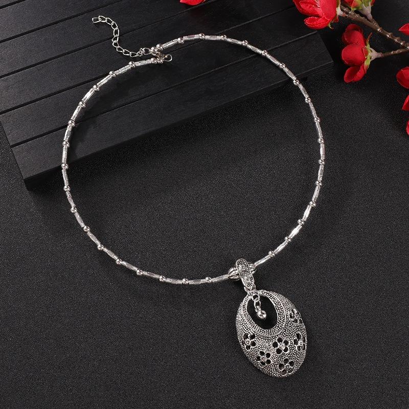 Vintage tassel collar hollow flower seedling silver pendant necklace niche personality collarbone chain women