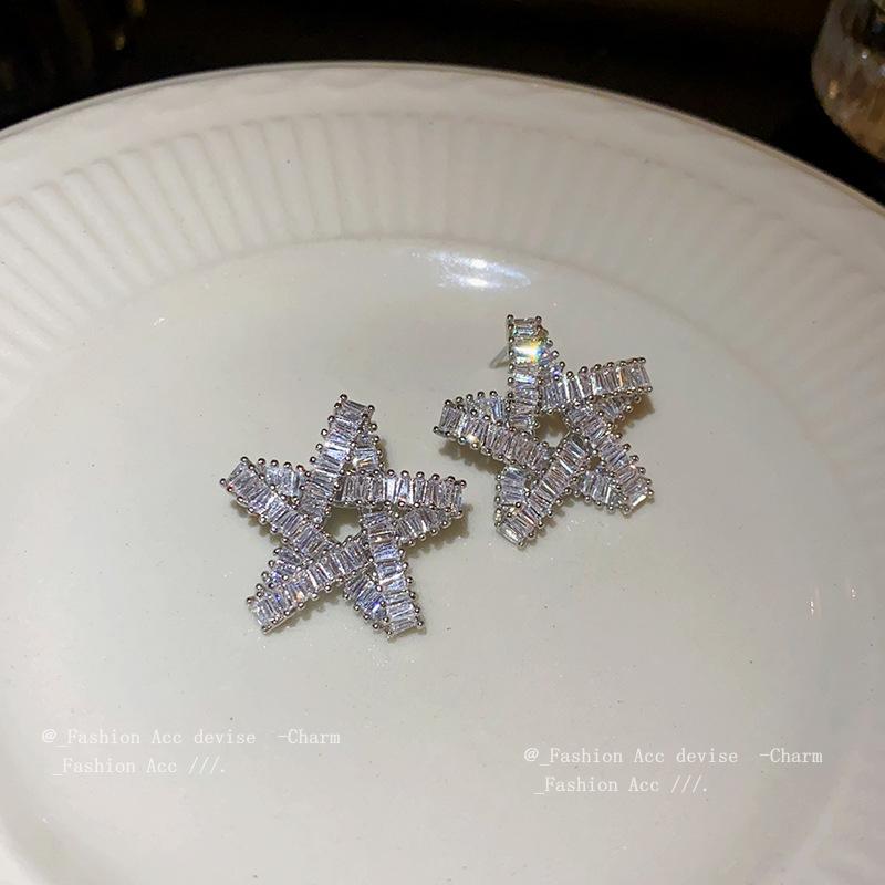 Silver needle zircon star hollow earrings, European and American exaggerated design studs, niche cold wind temperament earrings