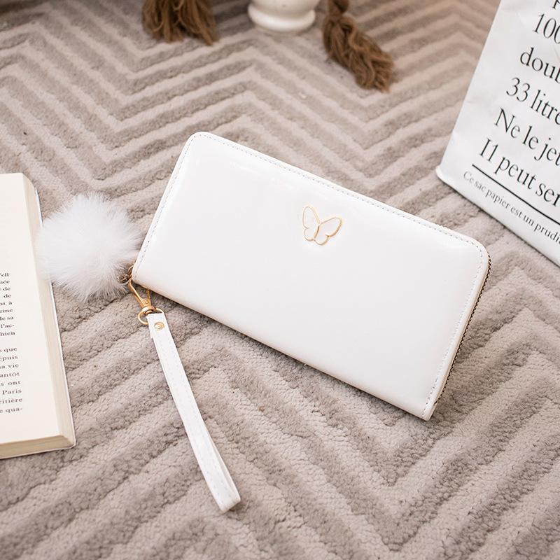 New solid color butterfly label wallet women's long zipper clutch bag hairball simple change bag one piece hair